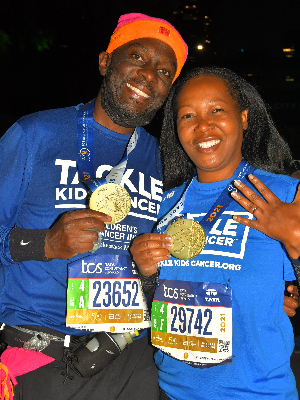 This lovely lady running 26.2 miles for Team TKC  received two medals  at our first marathon together last November 7th! Please ignore the conspicuous plastic/zip lock  in the runner belt bag to right of my water bottle; it kept the ring safe from the elements! Thank you so much for all your support for Team TKC!!!